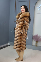 Load image into Gallery viewer, Full length muskrat fur hooded coat with racoon trim
