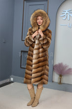 Load image into Gallery viewer, Full length muskrat fur hooded coat with racoon trim
