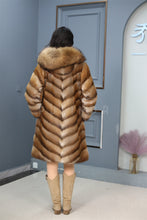 Load image into Gallery viewer, Full length muskrat fur hooded coat with racoon trim
