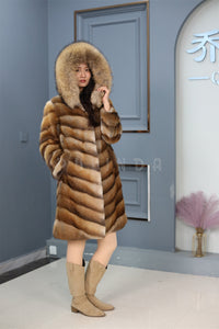 Full length muskrat fur hooded coat with racoon trim