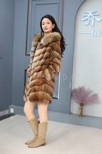 Load image into Gallery viewer, Full length muskrat fur hooded coat with racoon trim
