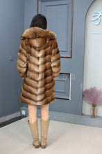 Load image into Gallery viewer, Full length muskrat fur hooded coat with racoon trim
