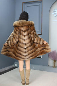 Full length muskrat fur hooded coat with racoon trim