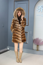 Load image into Gallery viewer, Full length muskrat fur hooded coat with racoon trim
