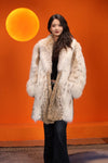 Mid-length women's natural lynx fur coat with shawl collar